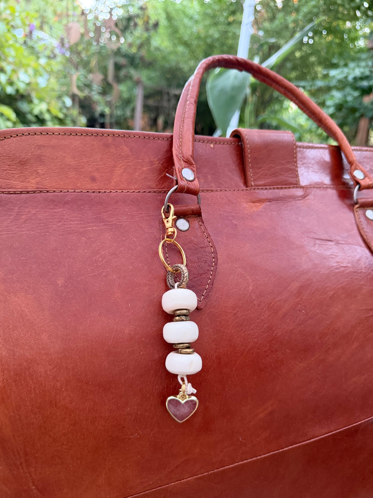 The Tenderness She Carries — Handmade Bag Jewelry