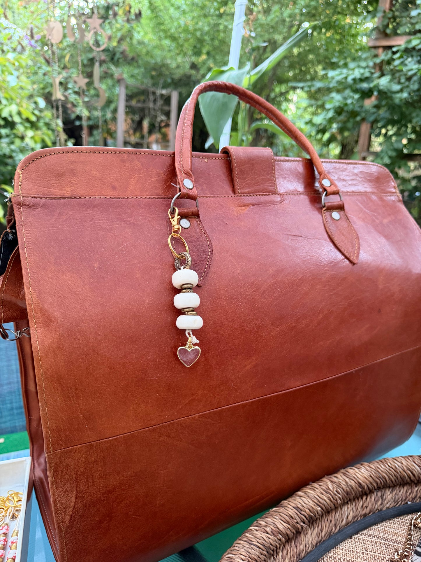 The Tenderness She Carries — Handmade Bag Jewelry
