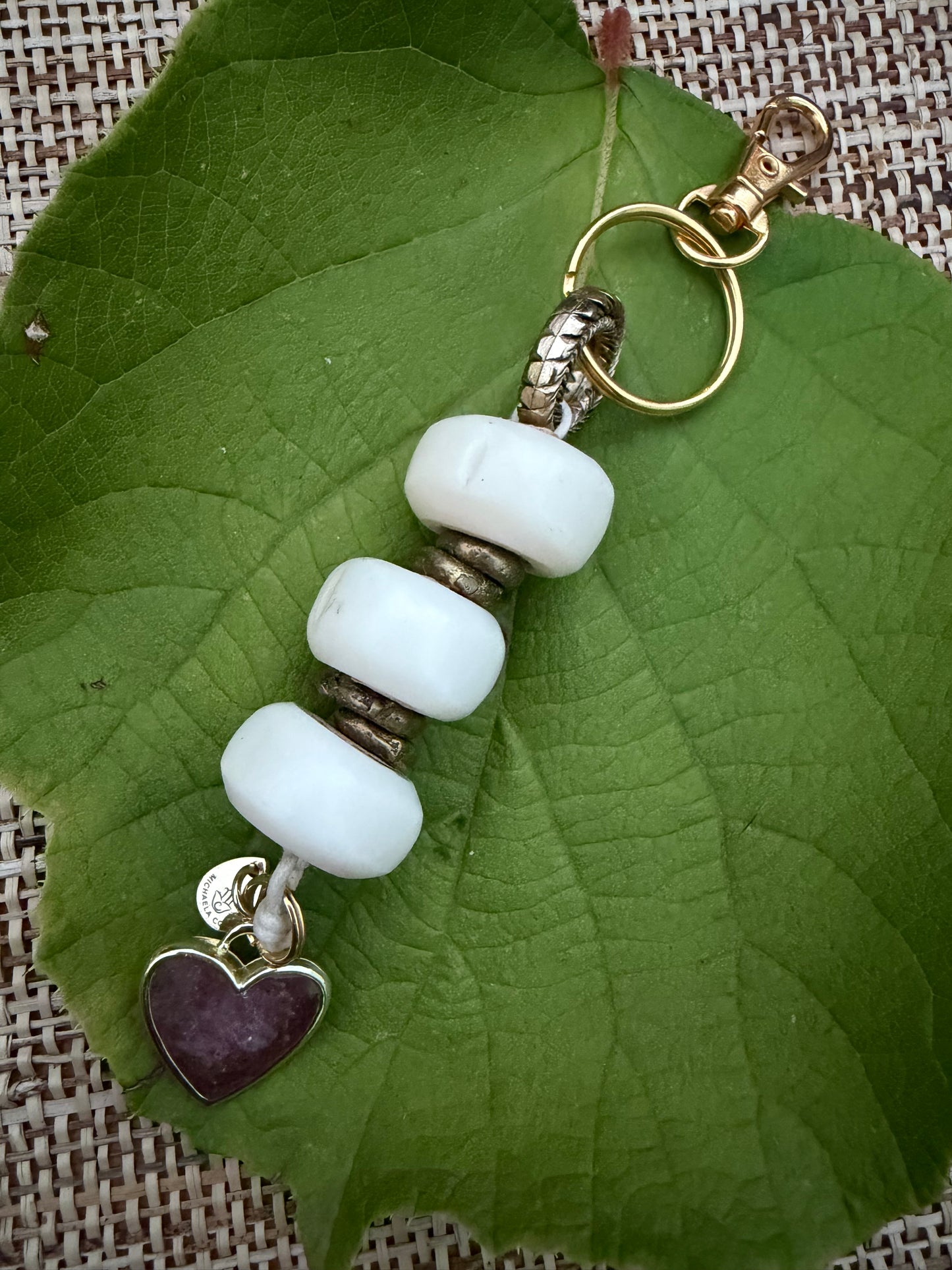 The Tenderness She Carries — Handmade Bag Jewelry