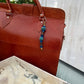 The Depth She Carries — Handmade Bag Jewelry