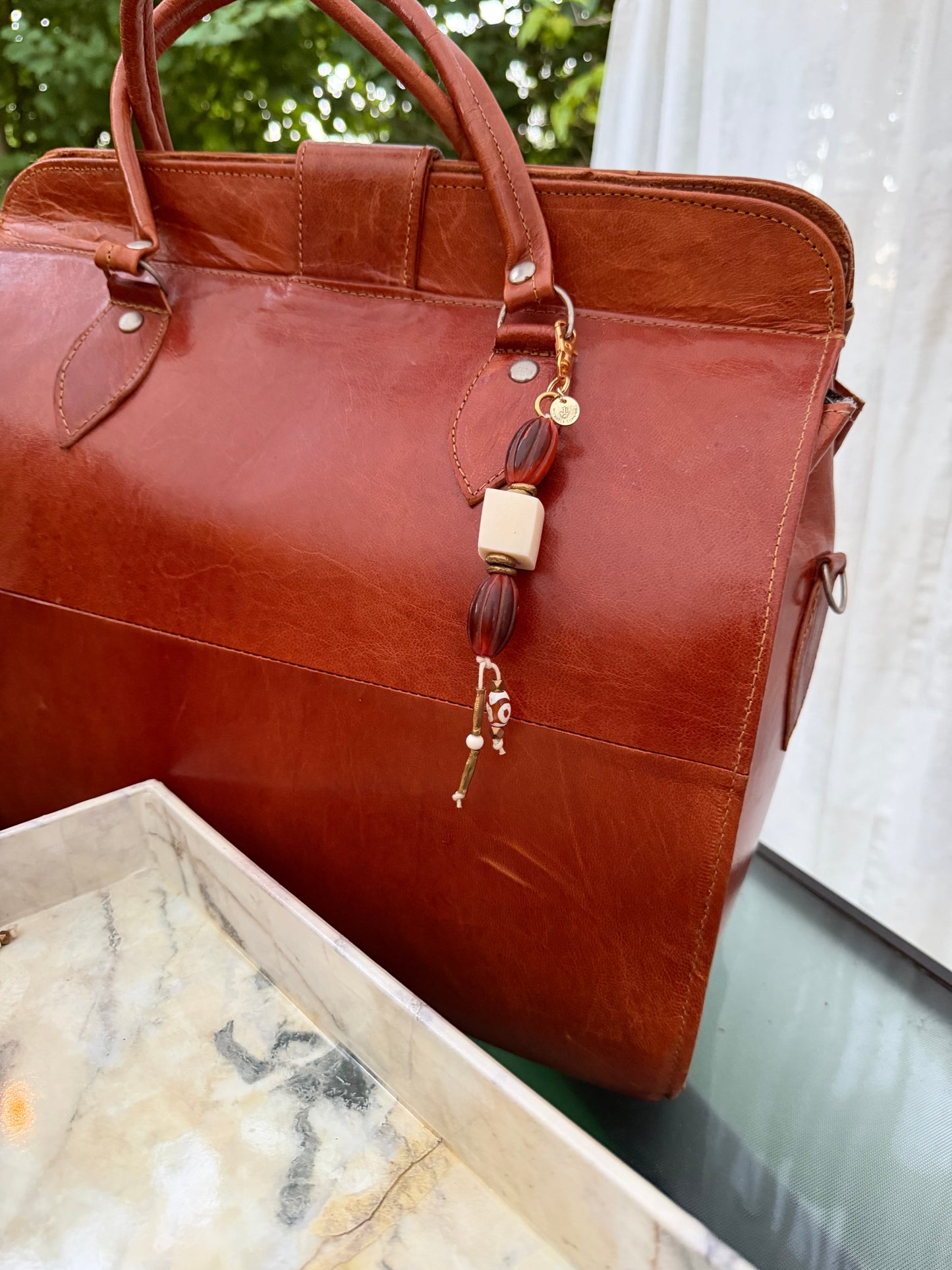 The Protection She Carries — Handmade Bag Jewelry