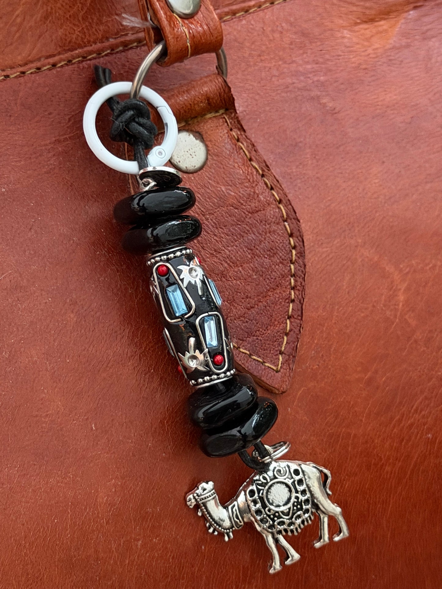 The Strength She Carries — Handmade Bag Jewelry